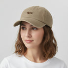 Beige baseball cap on a white background